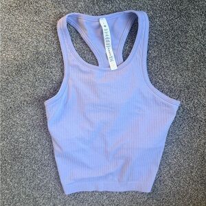 Lululemon cropped ebb to street tank in lavender.
Size 6